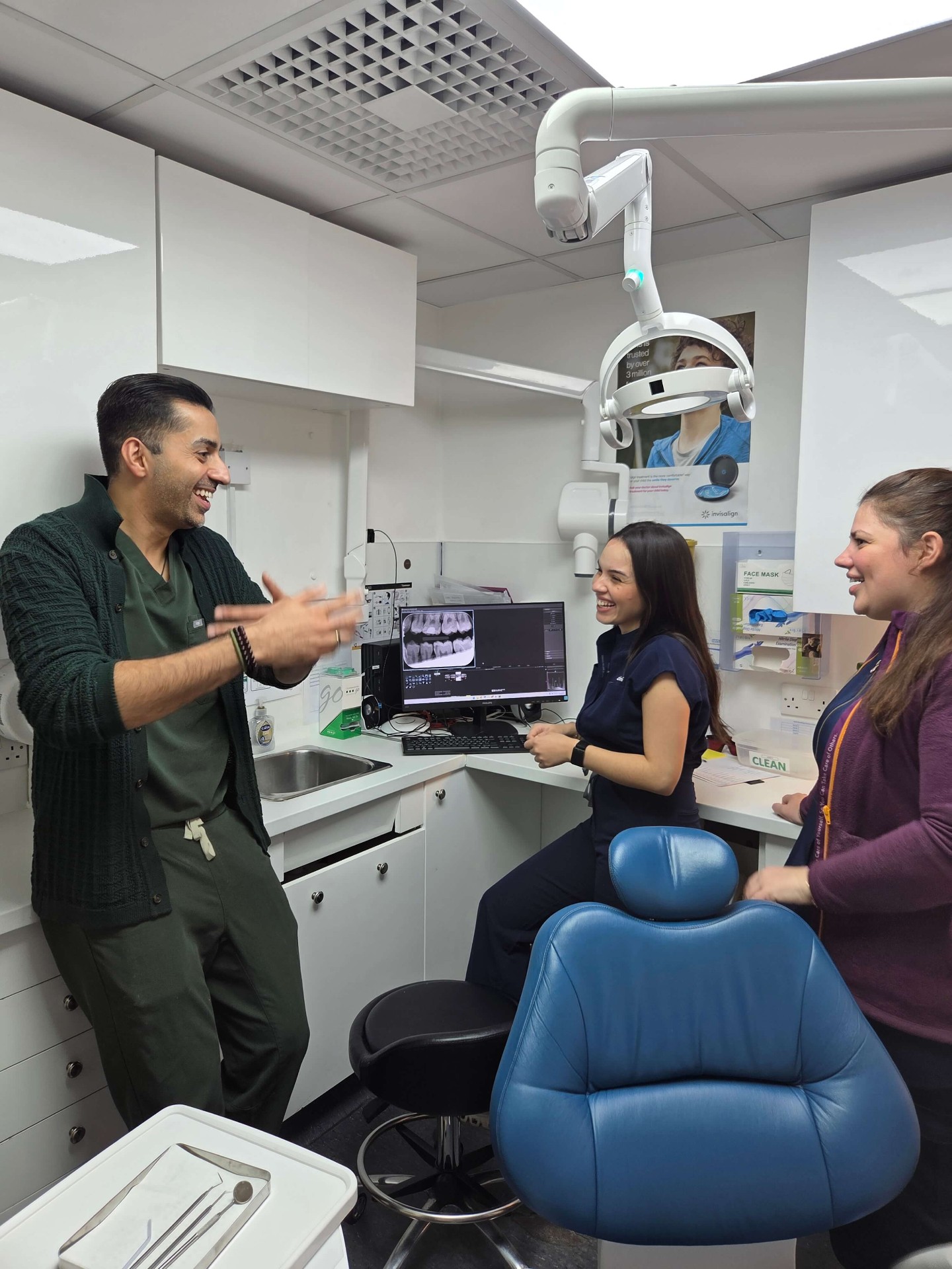 Dentist and team with patient